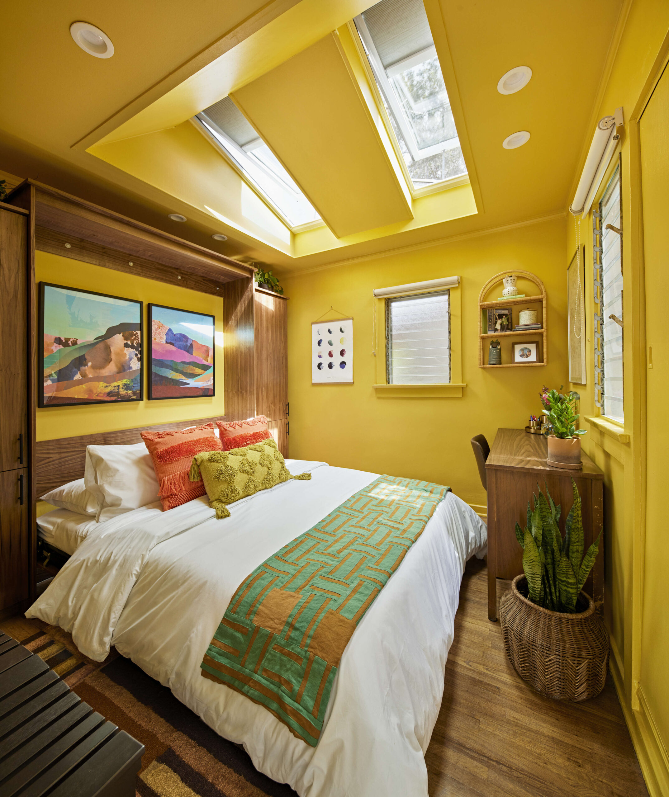 Cozy yellow bedroom loft conversion skylights